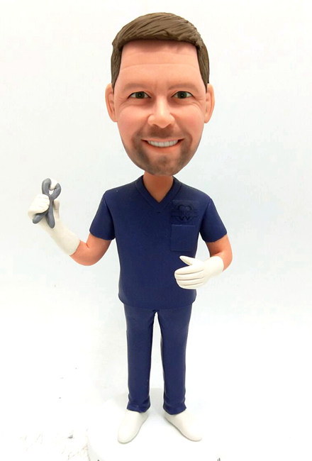 Custom bobblehead dentist in navy scrubs - Click Image to Close